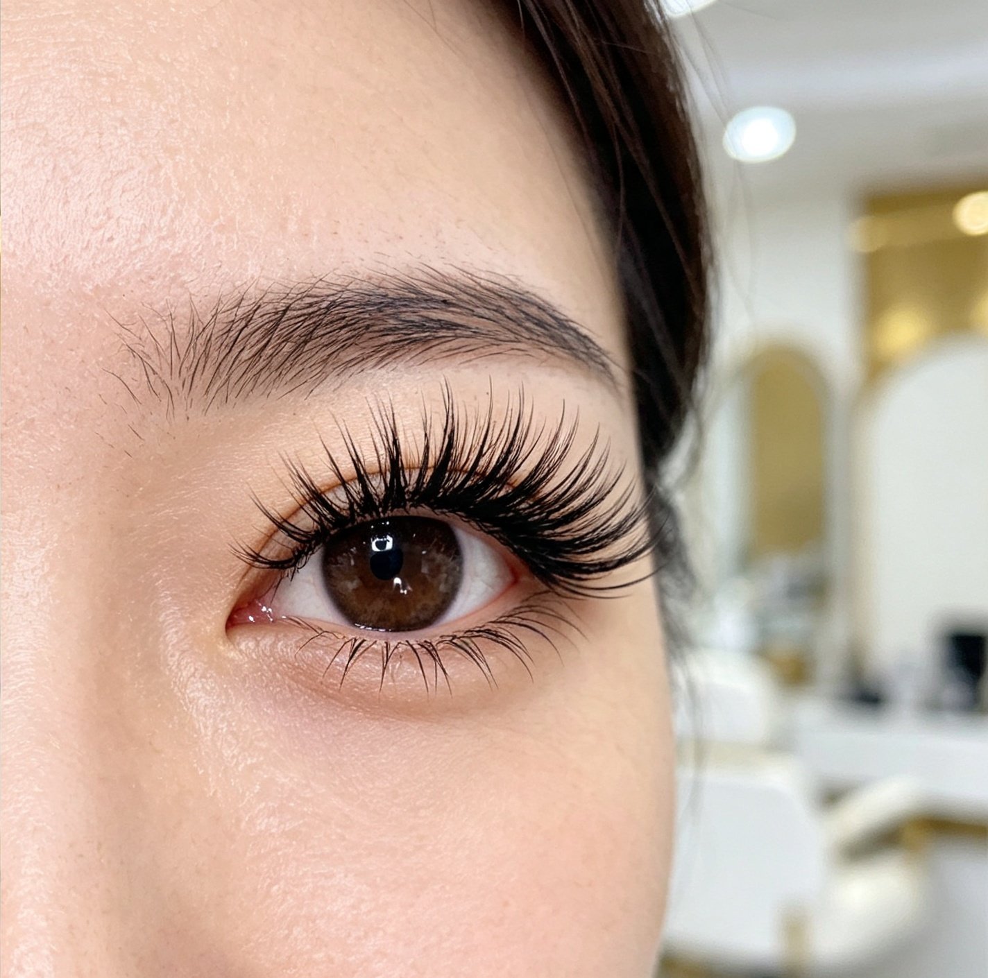 Close-up of full, natural-looking eyelash extensions at Lashdou